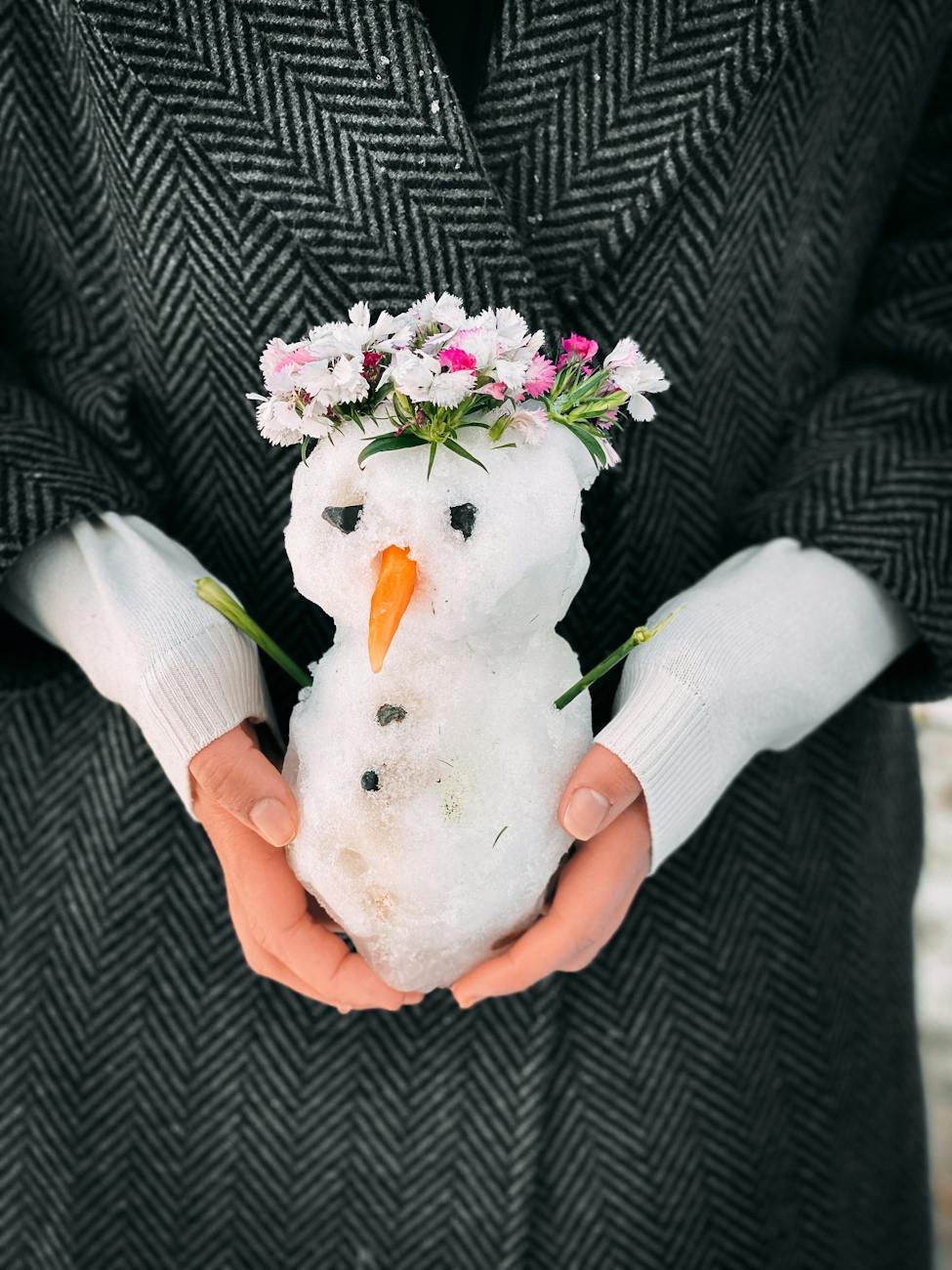 woman holding little snowman